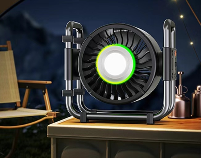 Portable camping fan‑light placed inside tent at night camping scene